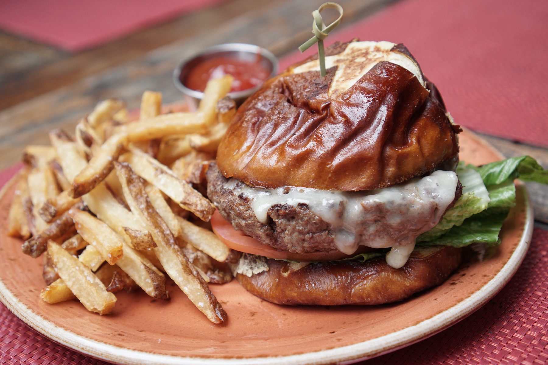 Reno — Pretzel bun burger with fries